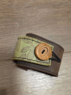 Leather Cuff Bracelet with Green Leaf Accent